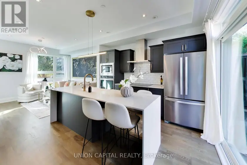 Townhouse at 952 DUNDAS STREET E, Toronto